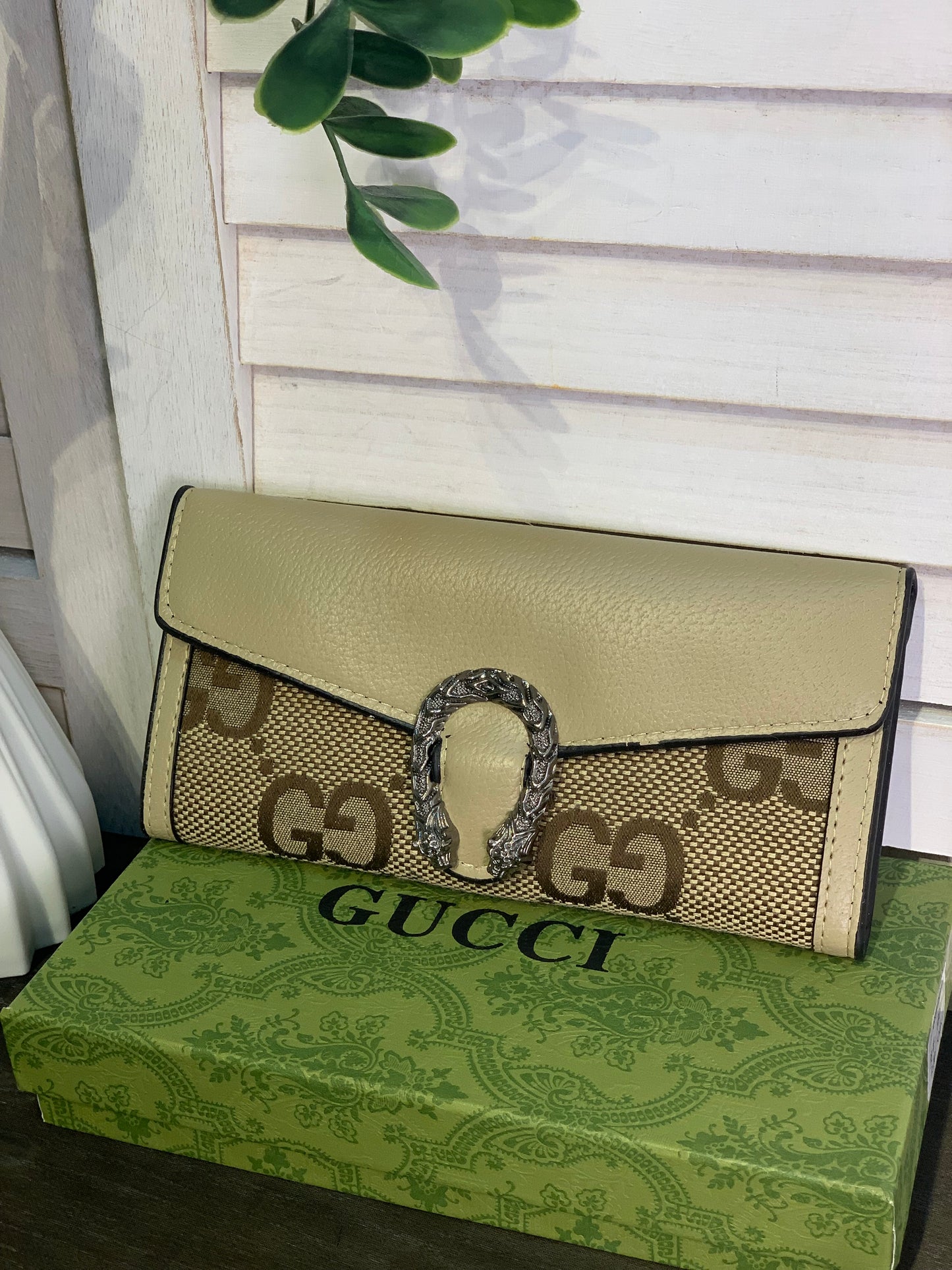 Two large Gucci purses with a box