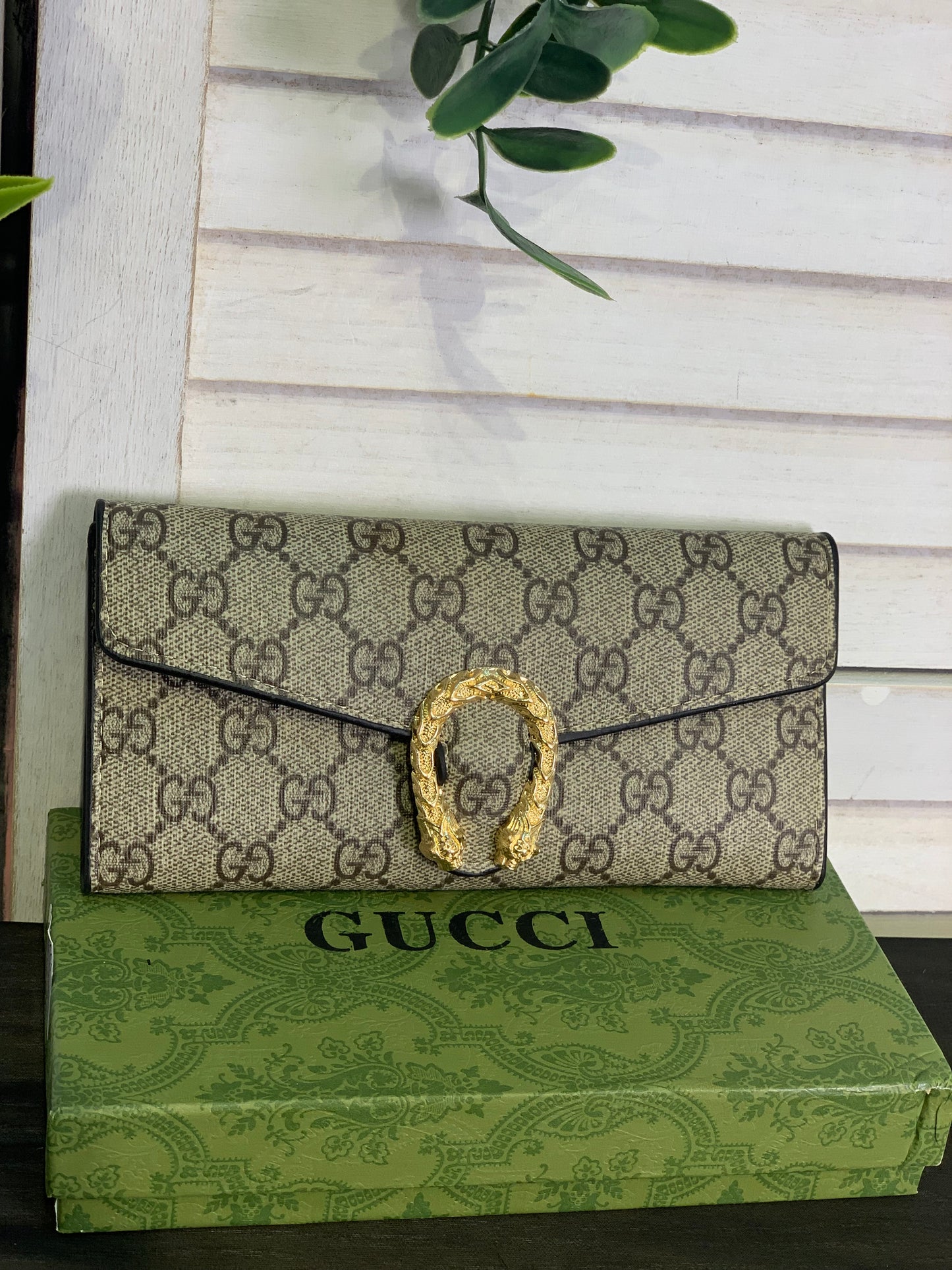 Two large Gucci purses with a box