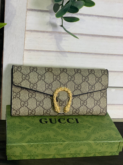 Two large Gucci purses with a box