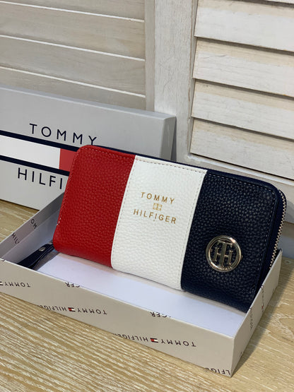 Two Tommy wallets with box