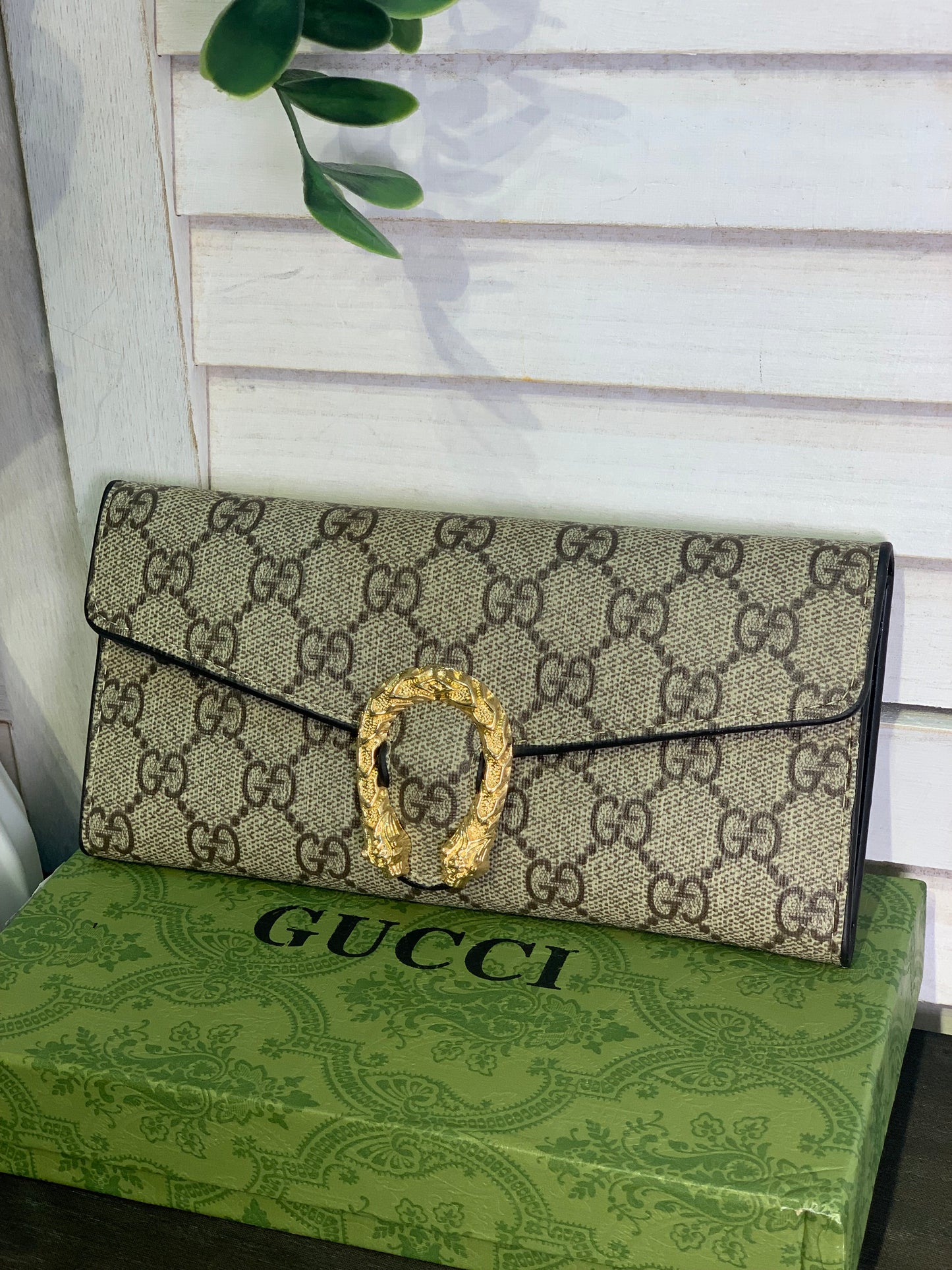 Two large Gucci purses with a box