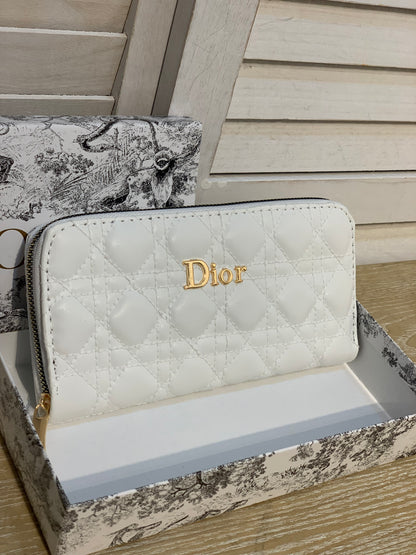 Two white Dior purses with a box