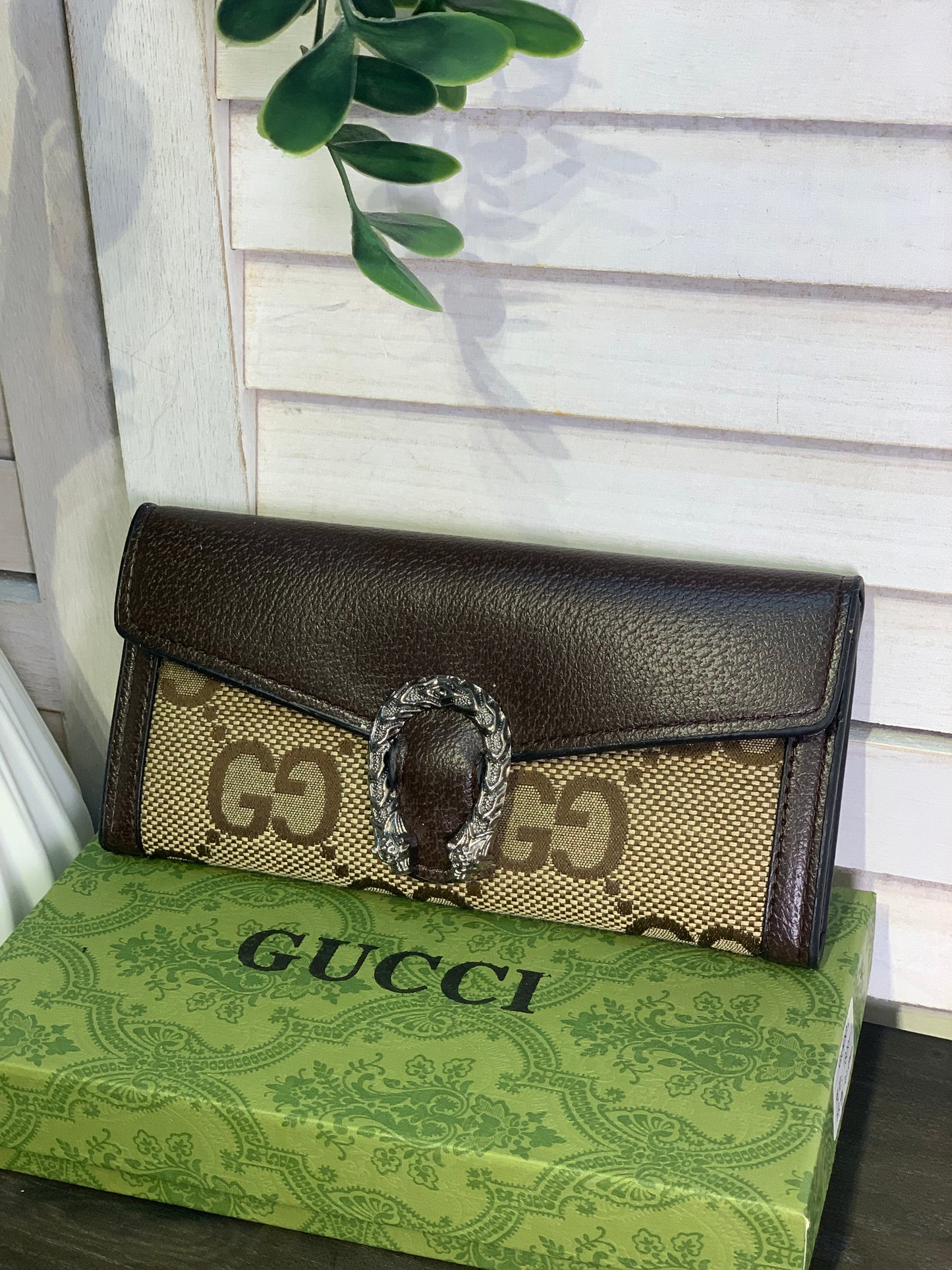 Two large Gucci purses with a box