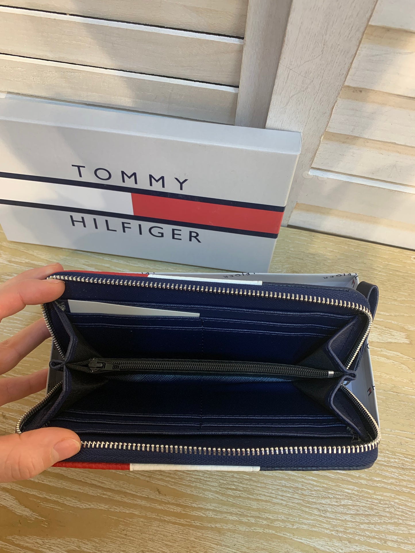 Two Tommy wallets with box