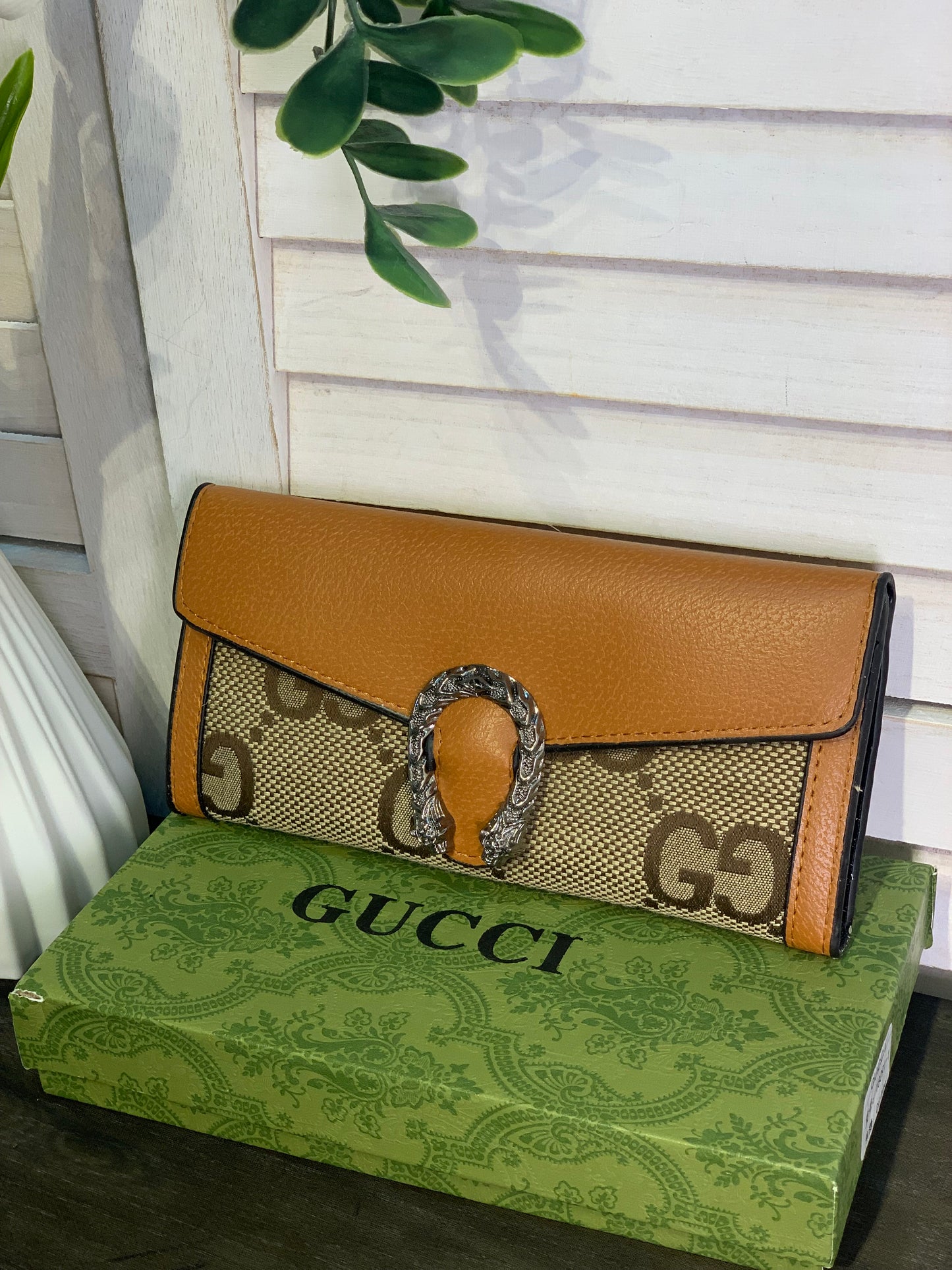 Two large Gucci purses with a box