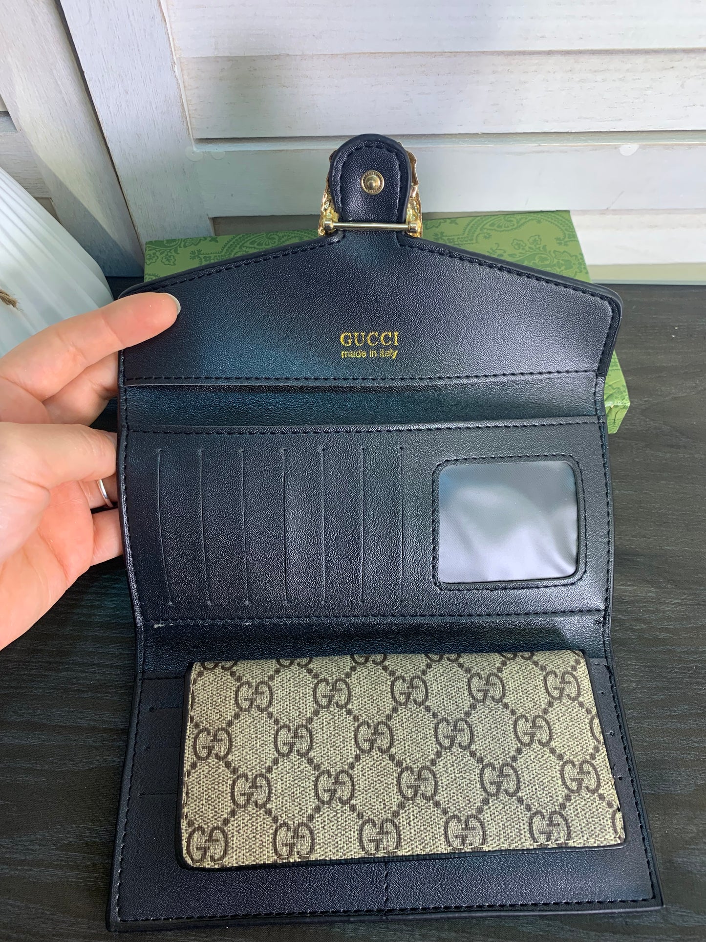 Two large Gucci purses with a box