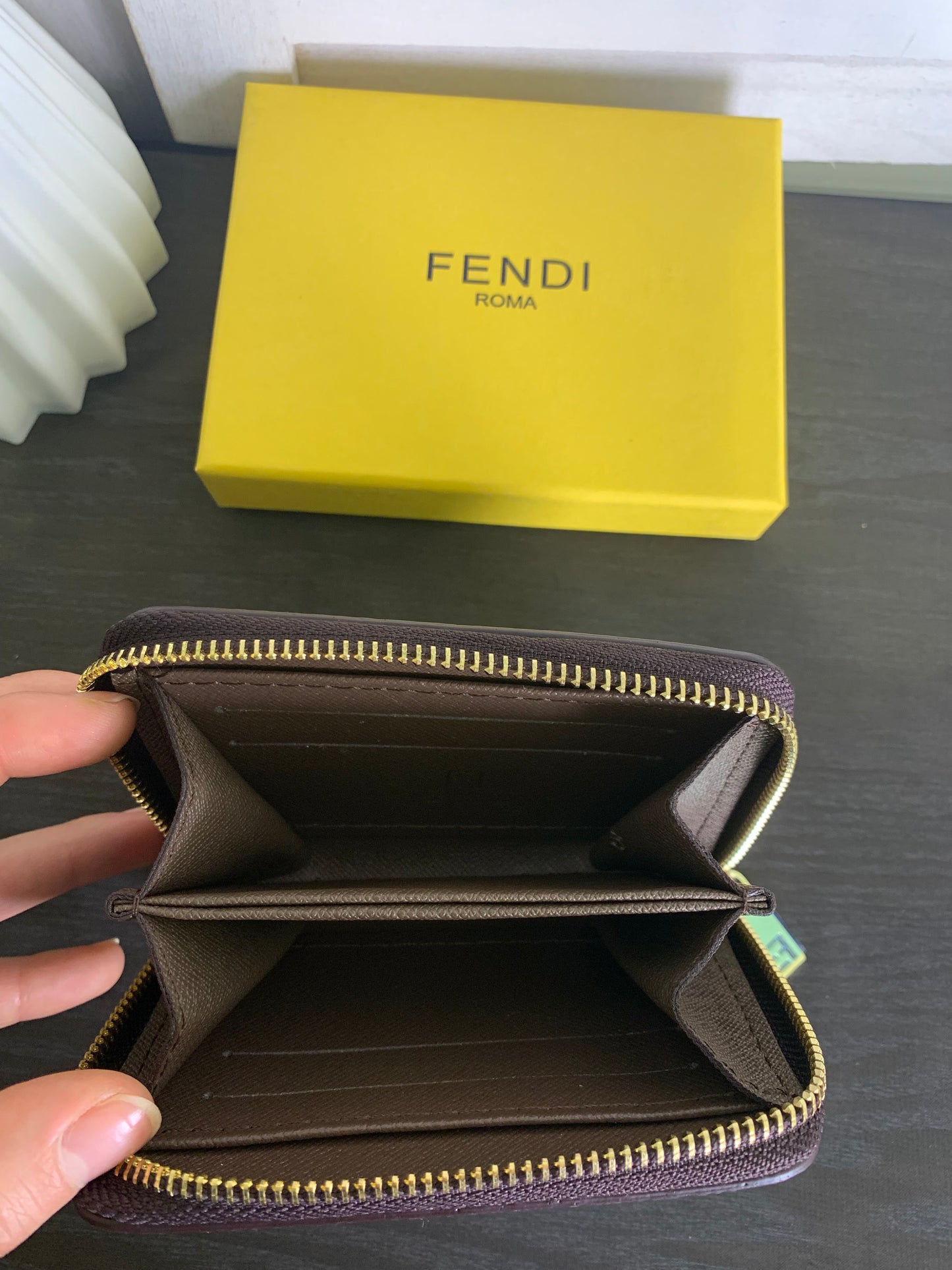 Two small Fendi purses with a box