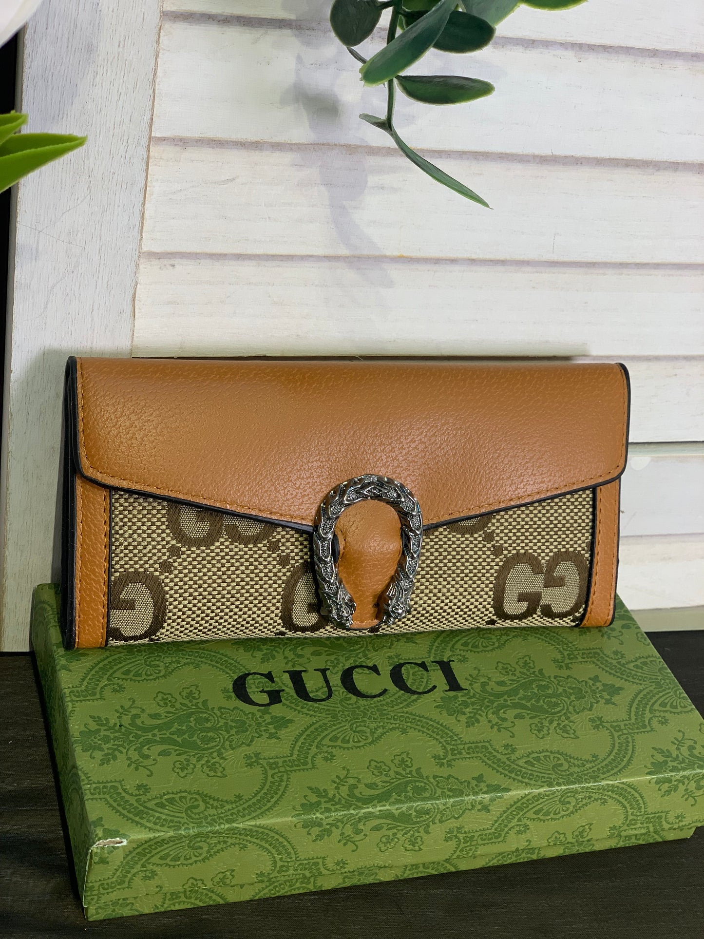 Two large Gucci purses with a box