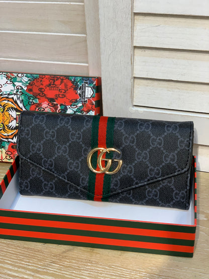 Two Gucci purses with a box