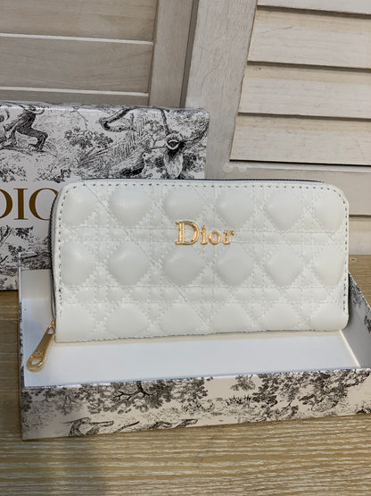 Two white Dior purses with a box